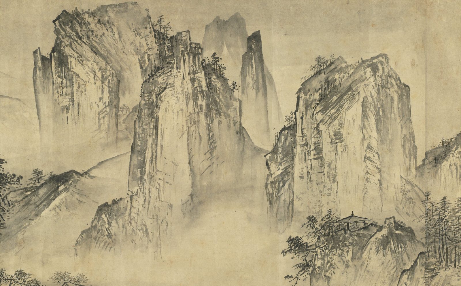 纸本水墨长卷中的一段：几座陡峭的山崖拔地而起，崖面用宽阔的方笔刷出棱角，崖脚是成片的树林；山崖之间雾气弥漫，远处还有更淡的峰头。